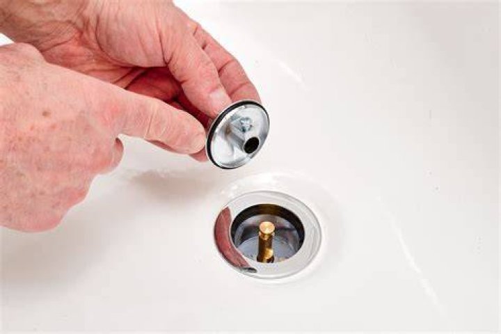 How do you fix a push down tub drain