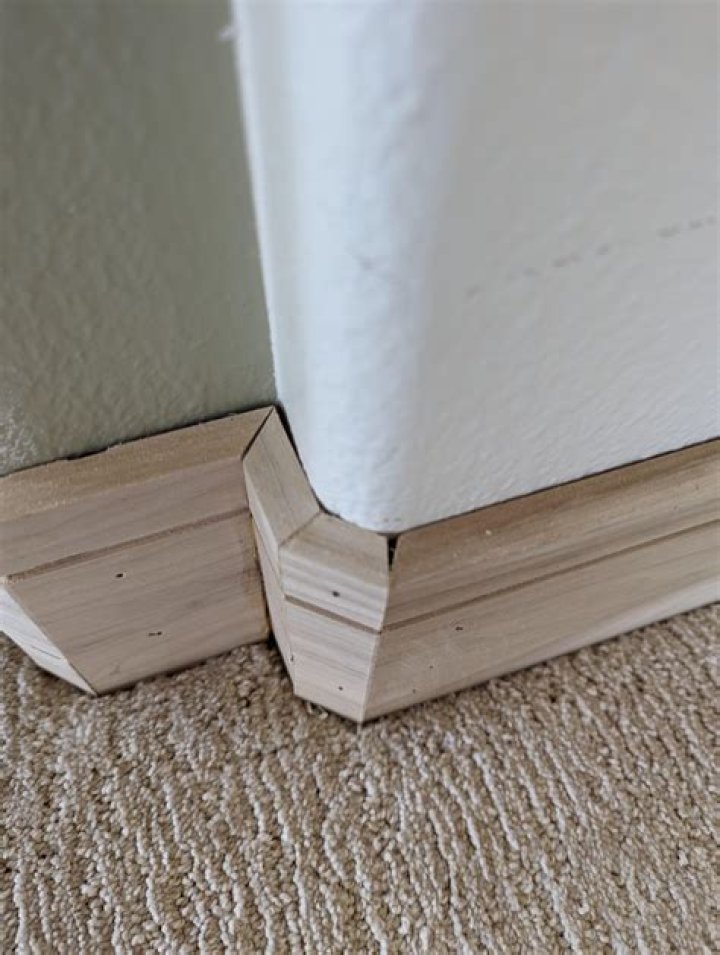 How do you install baseboard corners